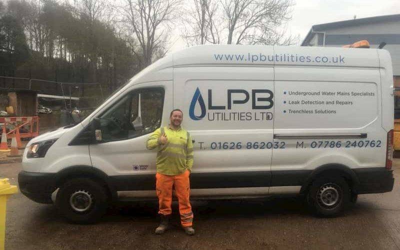 man next to lpb van