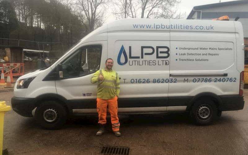 man next to lpb van