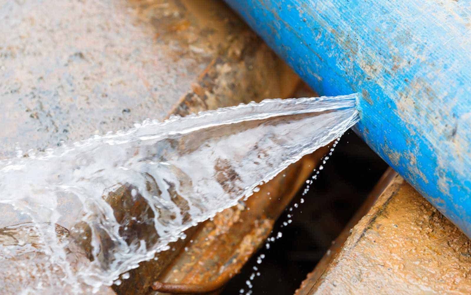 water main traced to find water leak with water spurting out
